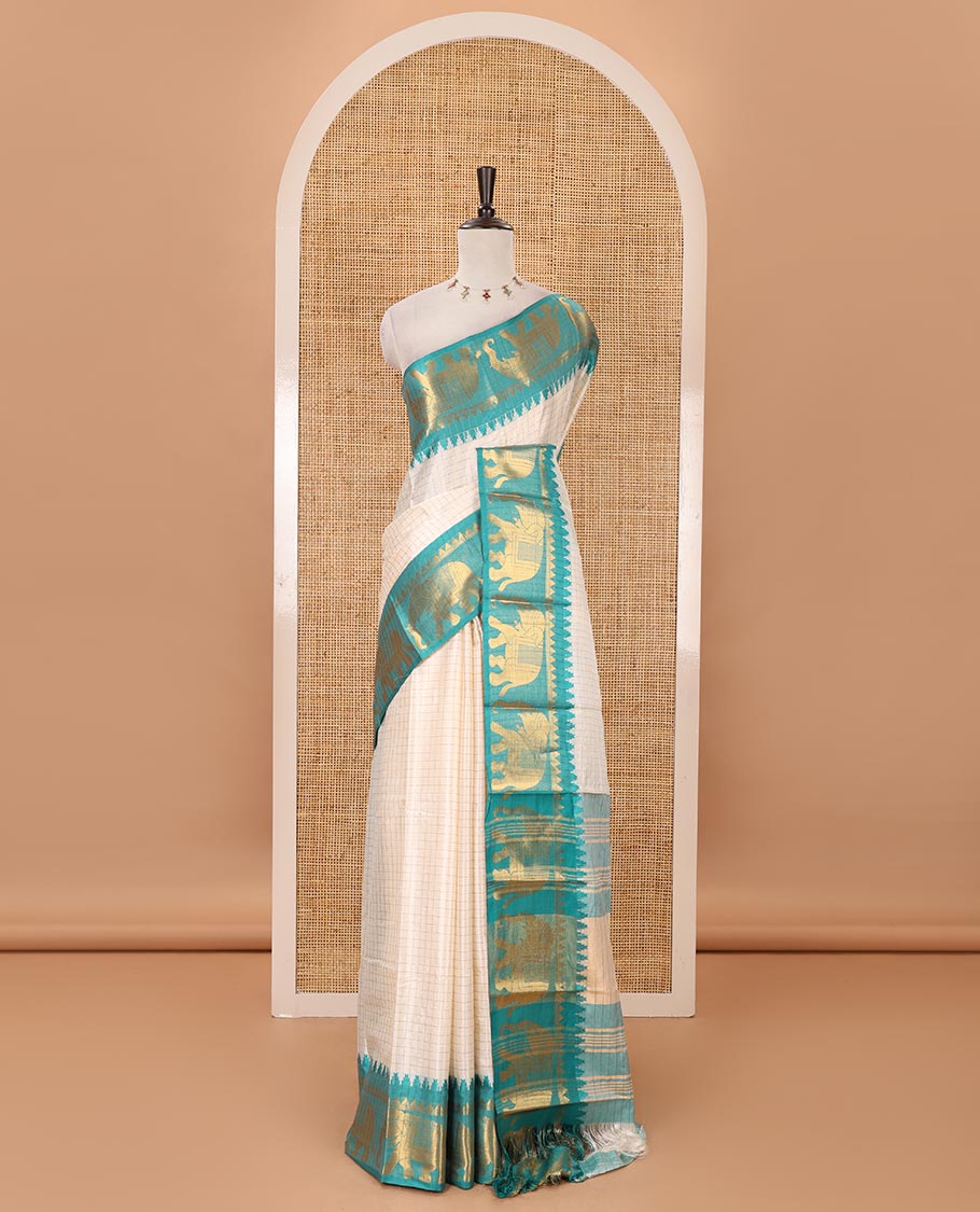 White checked semi-tafeta saree, contrast temple zari elephant motifs blue color border, zari-rich pallu & contrast checked zari border blouse