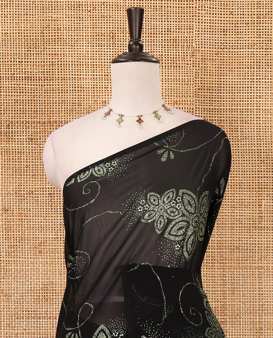 Borderless black 60 gm georgette saree features floral vine designs red glitter embroidery work, contrast plain blouse