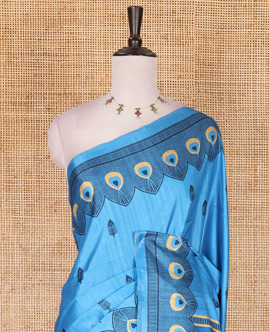 Blue peacock feathers motifs printed katan silk saree, peacock feathers printed border, contrast Radha Krishna stories printed pallu, and contrast printed blouse