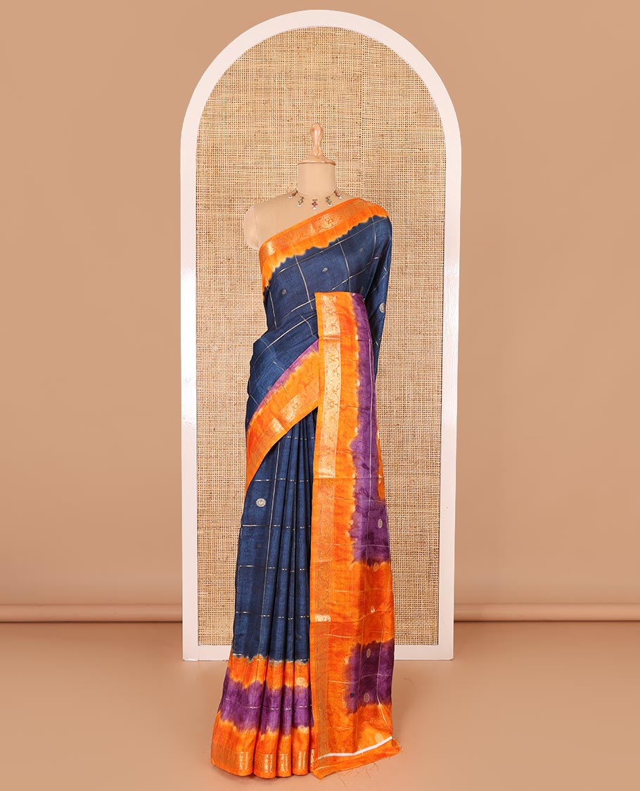 Blue buttas enclosed checked dola silk saree, contrast shibori print with traditional zari border, buttas enclosed checked pallu, and a contrast buttas enclosed checked blouse