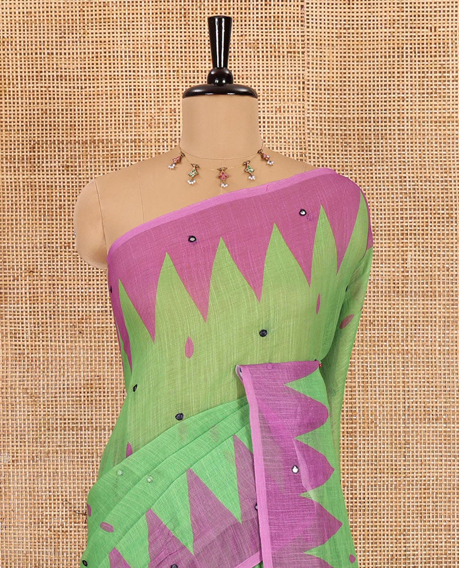 Green thilakam buttas and mirror work khadi mul cotton saree, contrast temple border, striped and buttas pallu, and a contrast printed blouse