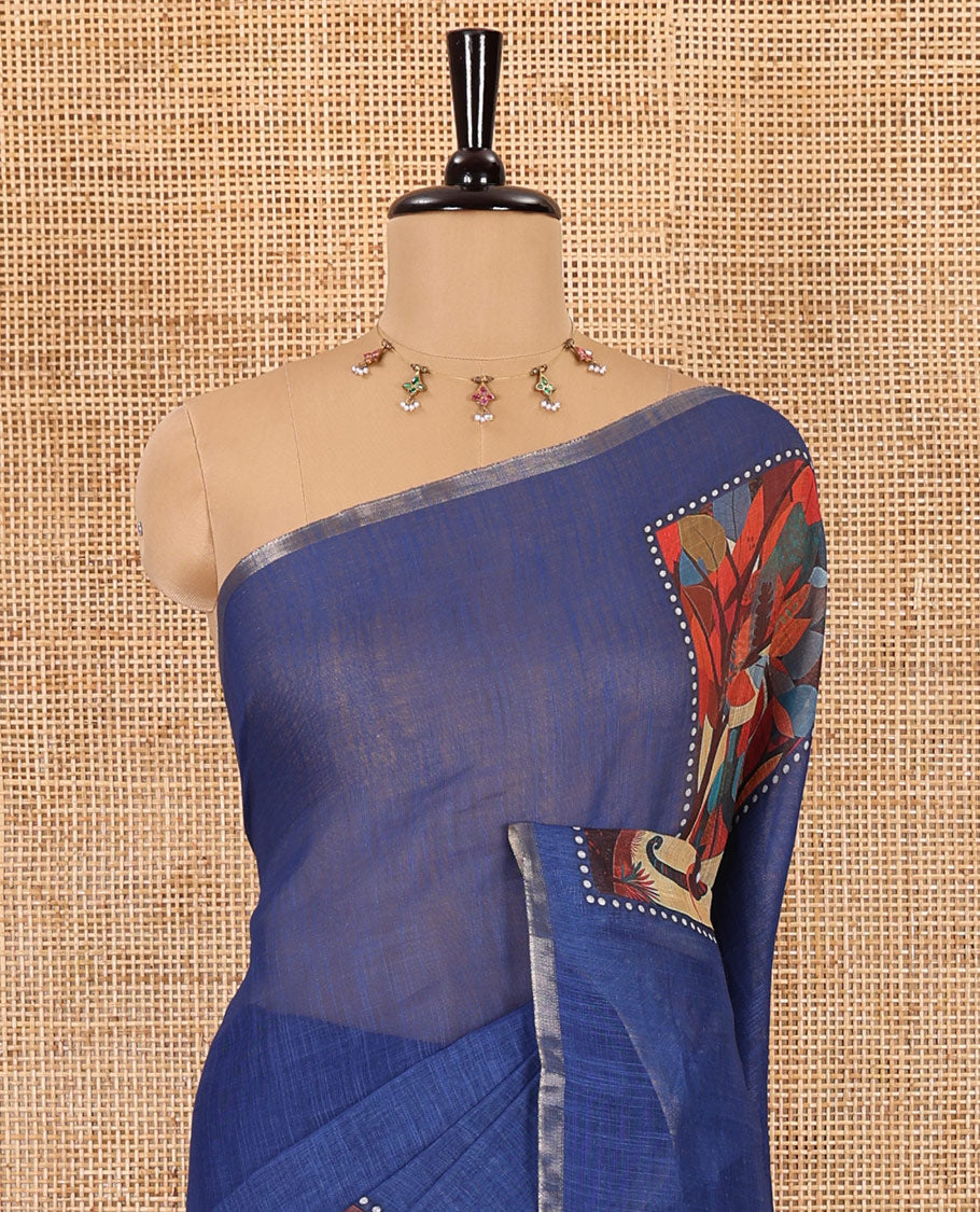 Indigo blue plain linen cotton saree, mordern art style elephant motifs printed border, elephant printed pallu, and a contrast floral vine printed blouse