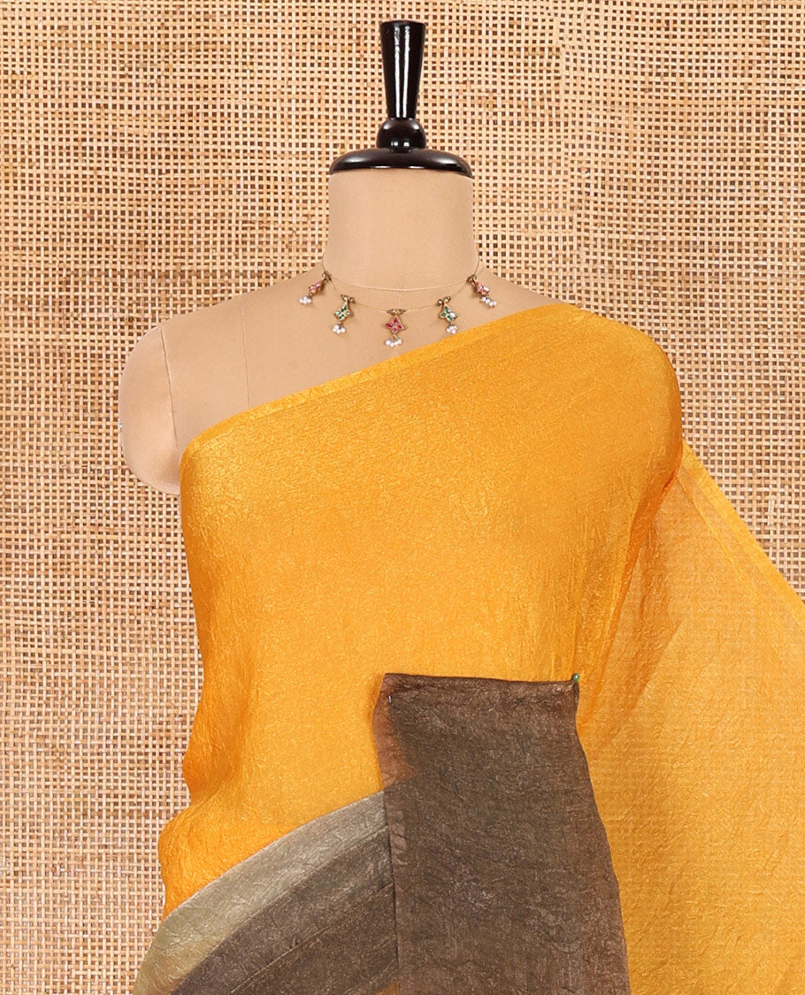 Borderless yellow and olive green ombre-style crushed plain fendy chiffon saree, self-pallu, and a matching plain blouse
