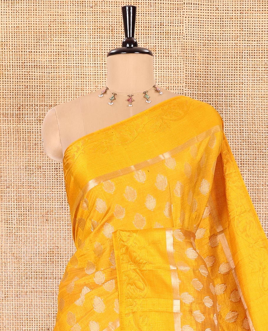 Yellow Semi-Tussar Saree Ornamented with Copper Zari Floral Bud Motifs, Featuring a Floral Creeper Embossed Border, Complemented by a Contrast Pallu Adorned with Floral Bud Motifs, and Paired with a Contrast Blouse