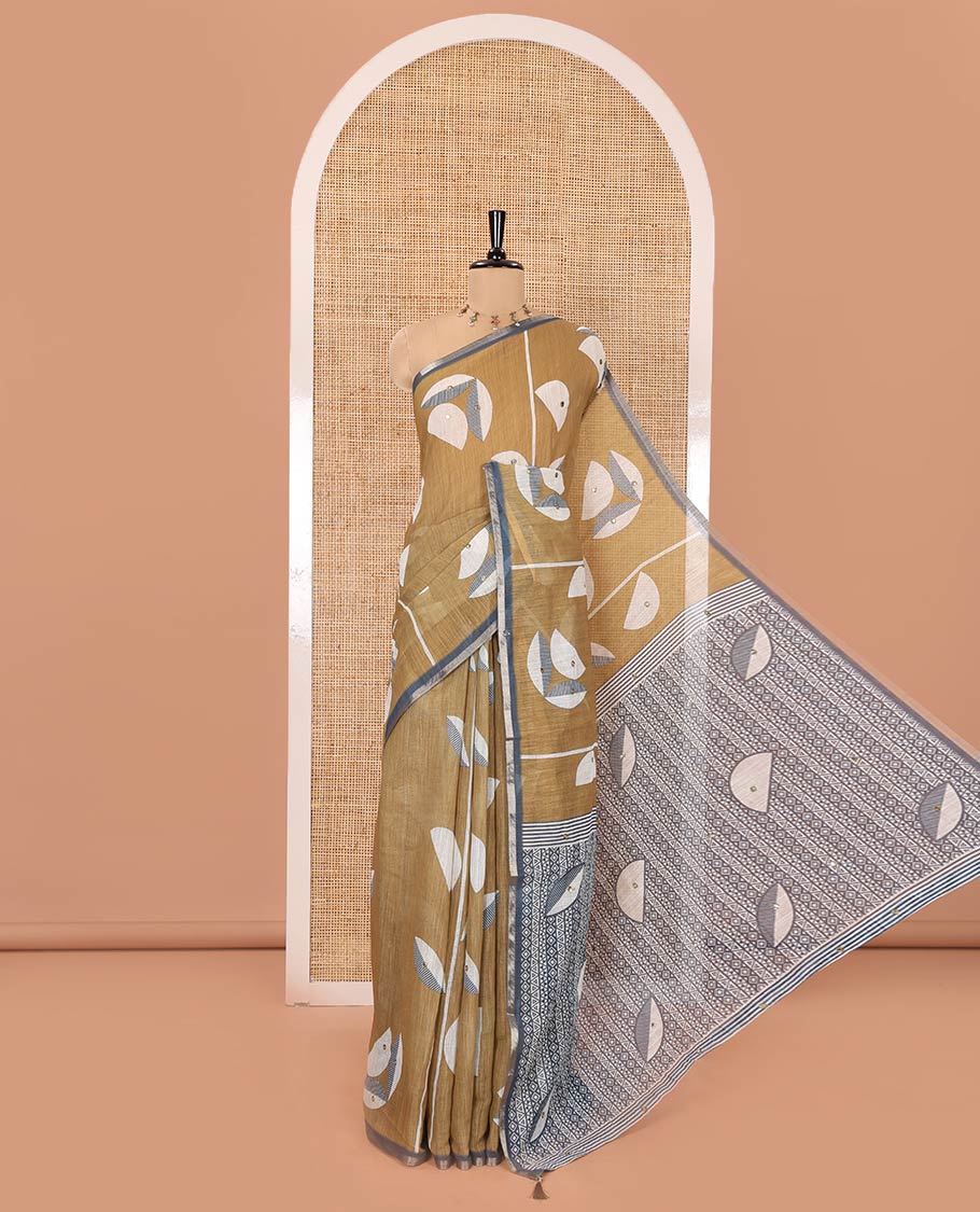 Green Linen Saree, Subtly Sparkled with Geometric Print and Mirror Work on Its Body, Subtle Piping Border, Pallu Steeped with Geometric Patterns, and Paired with Unique Motifs Printed Contrast Blouse