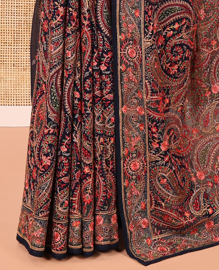Navy Blue Georgette Saree, Ornamented with Intricate Paisleys, Kashmir Embroidered and Stone Work on Its Body, a Self-Embroidered Border, and Paired with an Embroidered Blouse