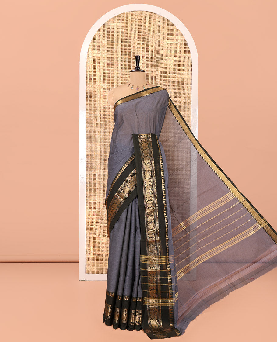 Grey Plain Chettinad Cotton Saree, Complemented by Contrast Rettai Pettu Traditional Zari Border of Temple and Peacock Designs, Striped Pallu, and Paired with a Matching Blouse