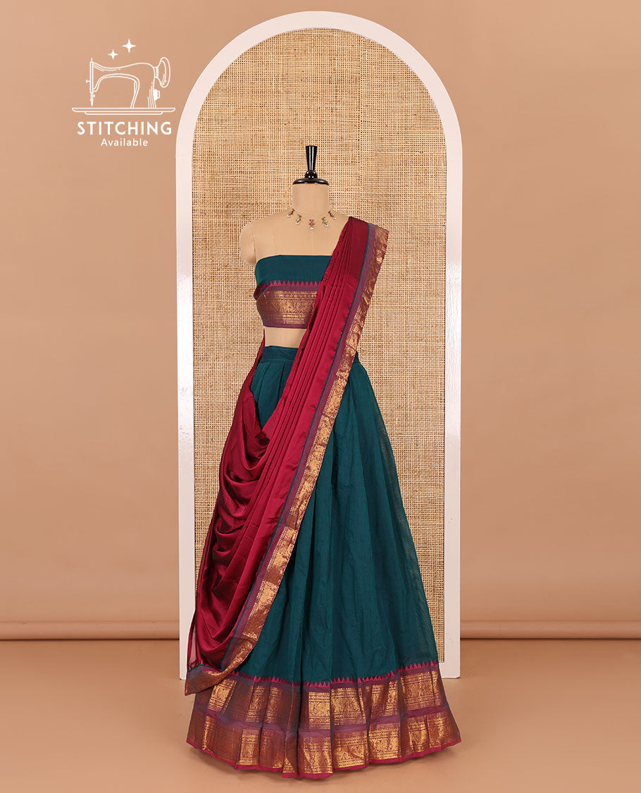 Peacock-rani pink sungudi cotton half-saree, plain with contrast traditional zari varisai pettu bordered skirt, a matching blouse, and a zari bordered dhavani