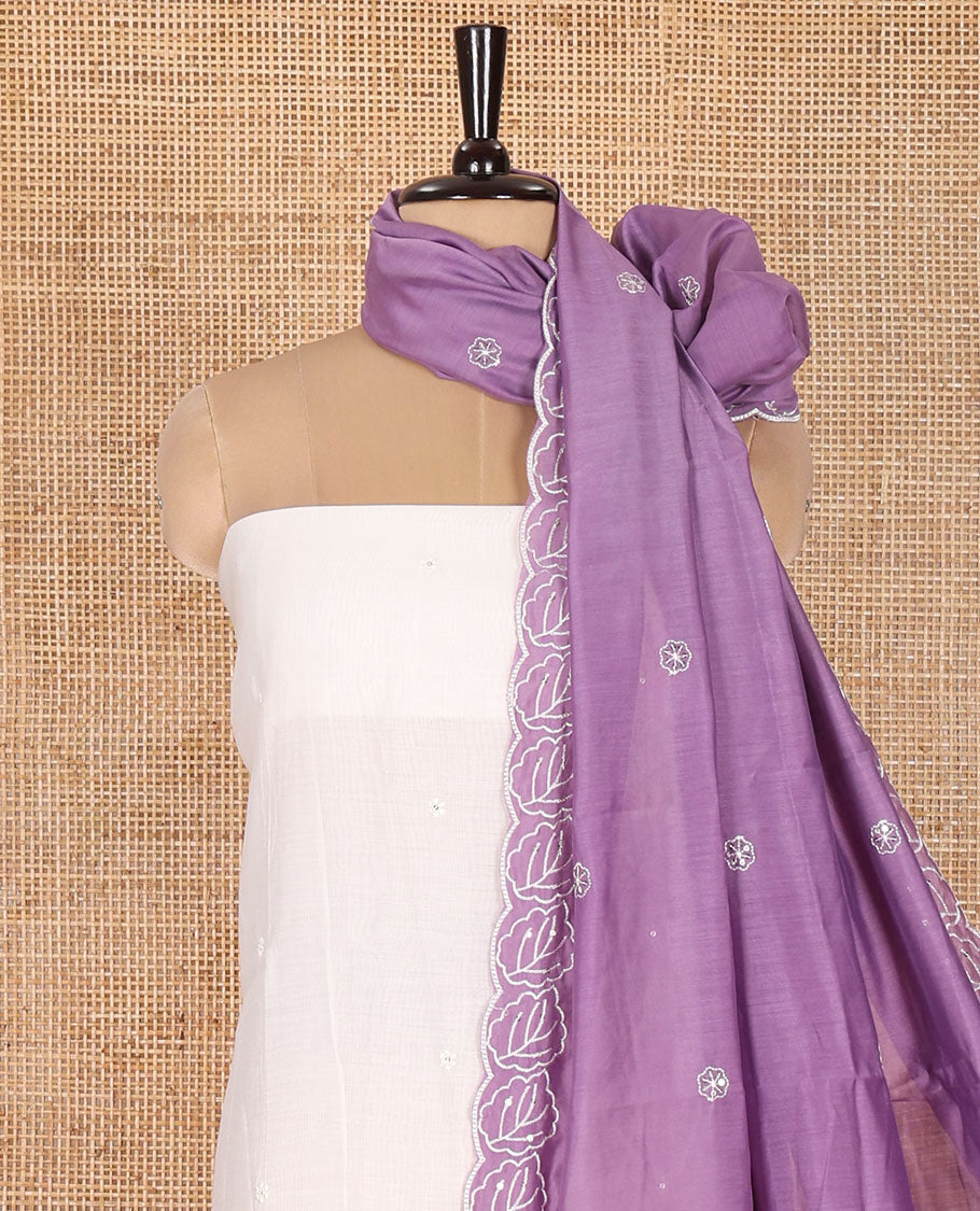 Cream and Lavender Mul Chanderi Material Chudidar Set, Beautiful Bedecked with Floral Embroidery On Its Top, A Plain Santoon Bottom, and Comes with a Contrast Scallop Floral Embroidered Dupatta