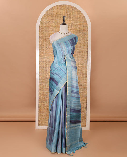 Sky blue hand brushing-style multi-colored stripes printed fancy tussar silk saree, zari border, self-pallu & blouse of zari work & stripes print