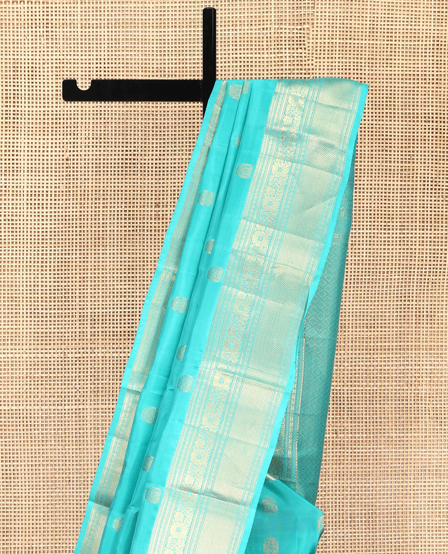 Blue Vasundhara Lite Silk Mix Saree, Sparsely Woven with Zari Buttas, Highlighted by a Zari Border of Rekku, Kamalam, and Mayil Kann Designs, Pallu of Jaal Designs, and Paired with a Matching Blouse