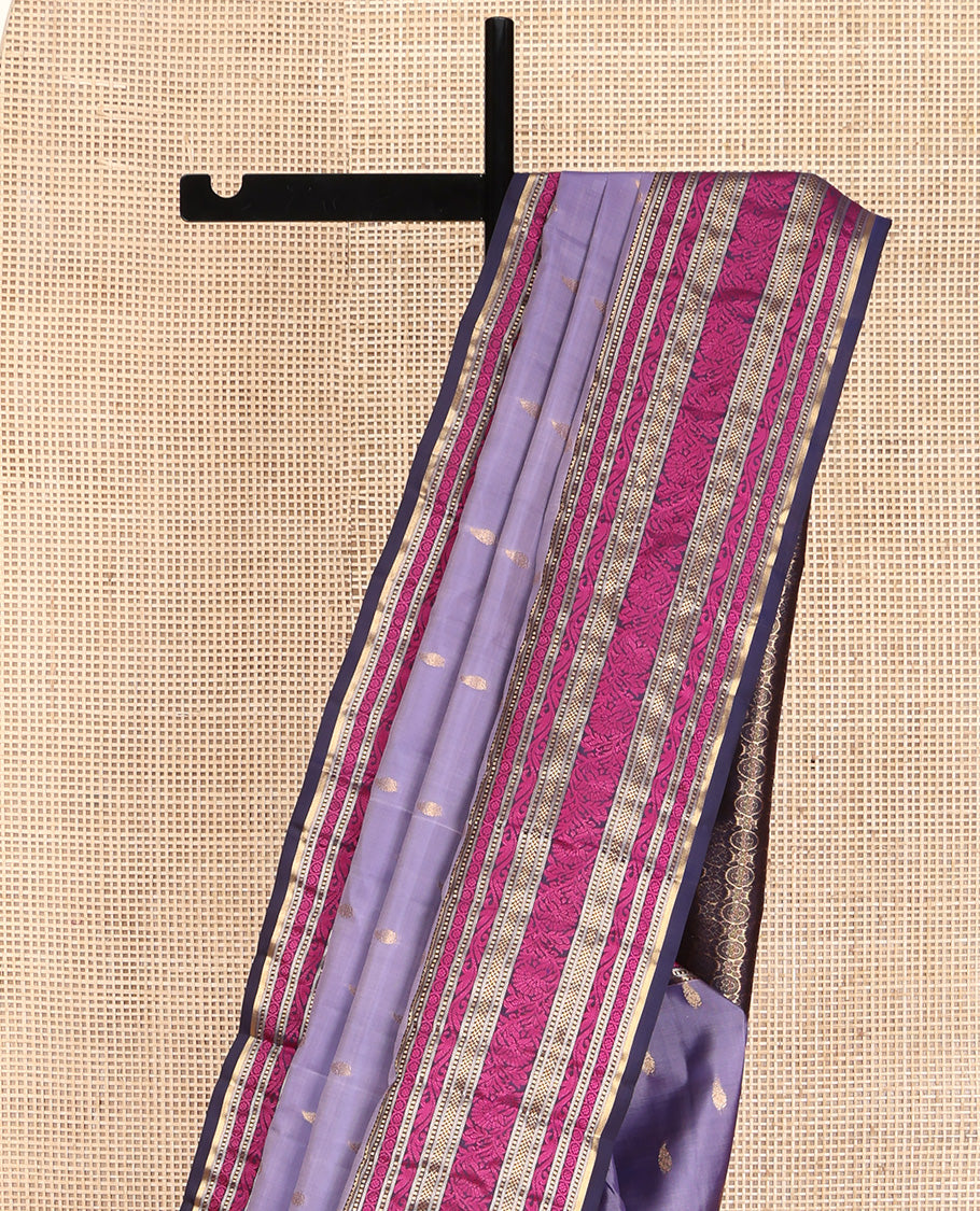 Lavender Vasundhara Lite Silk Mix Saree, Embellished with Zari Buttas on Its Body, Complemented by a Contrast Border of Rekku, Muthu, and Kodi Visiry Designs, Pallu Steeped with Chakram Designs, and Paired with a Contrast Blouse