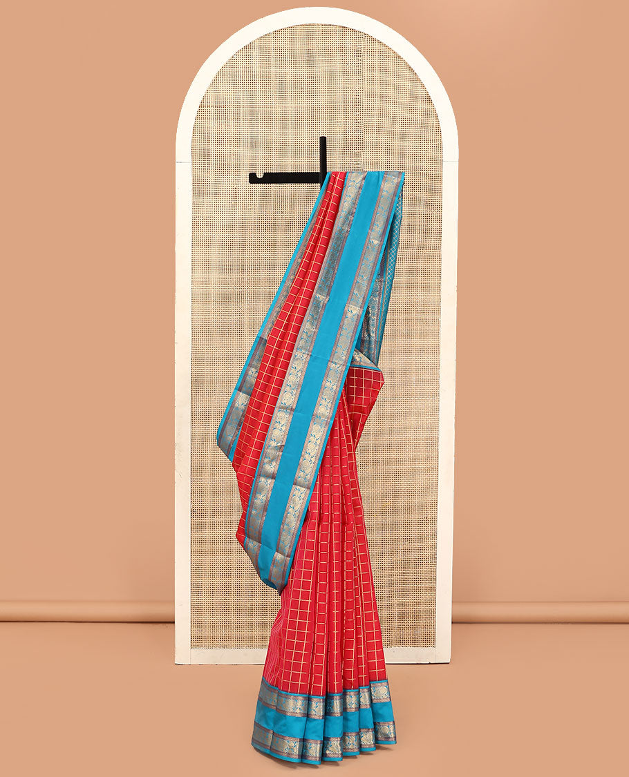 Red Vasundhara Lite Silk Mix Saree, Beautified with Zari Checked Designs on Its Body, Complemented by a Contrast Rettai Pettu Border of Cross Kamalam, Mayil, and Manga Designs, Gleaming Zari Design Pallu, and Paired with a Contrast Blouse