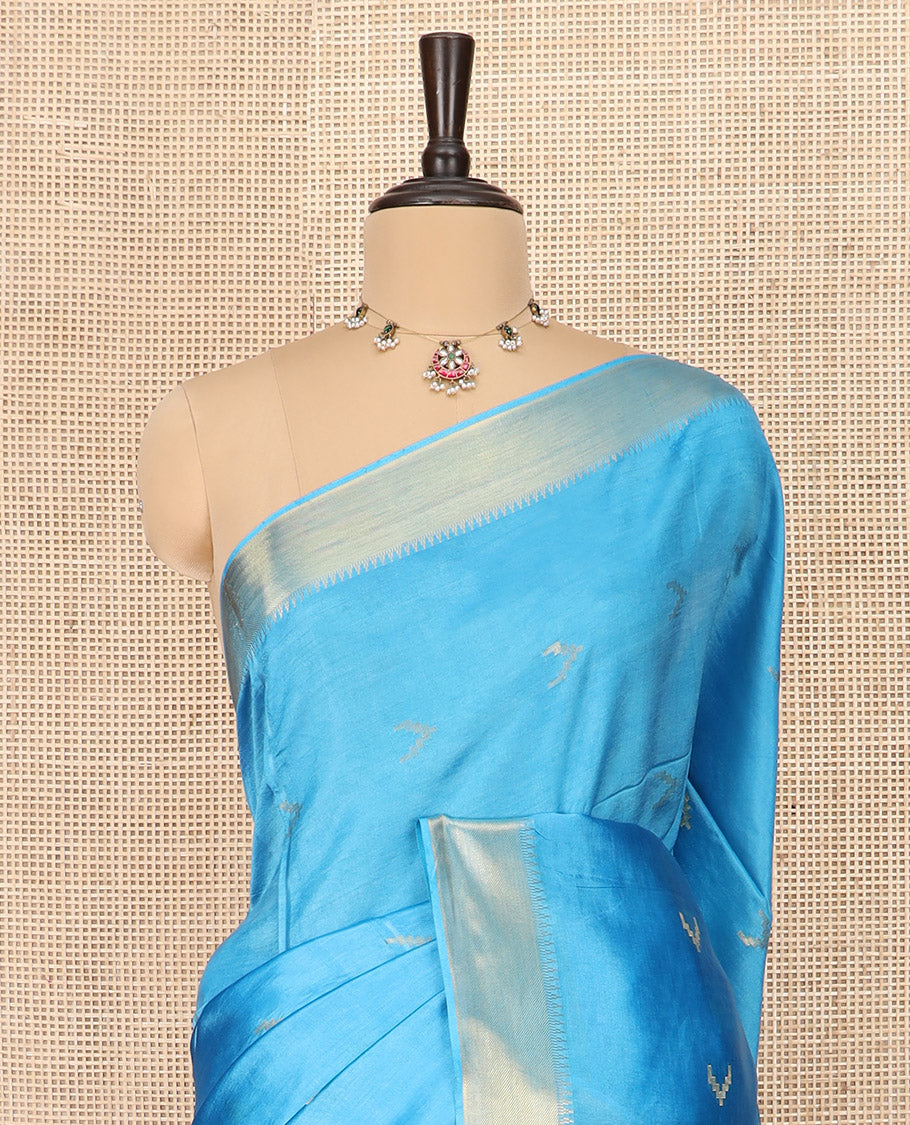 Blue Banana Pith Saree Decorated with Zari Temple Buttas, Delicately Woven Temple Zari Border, Gleaming Zari Pallu of Horizontal Stripes in Zari, and Paired with a Matching Plain Blouse