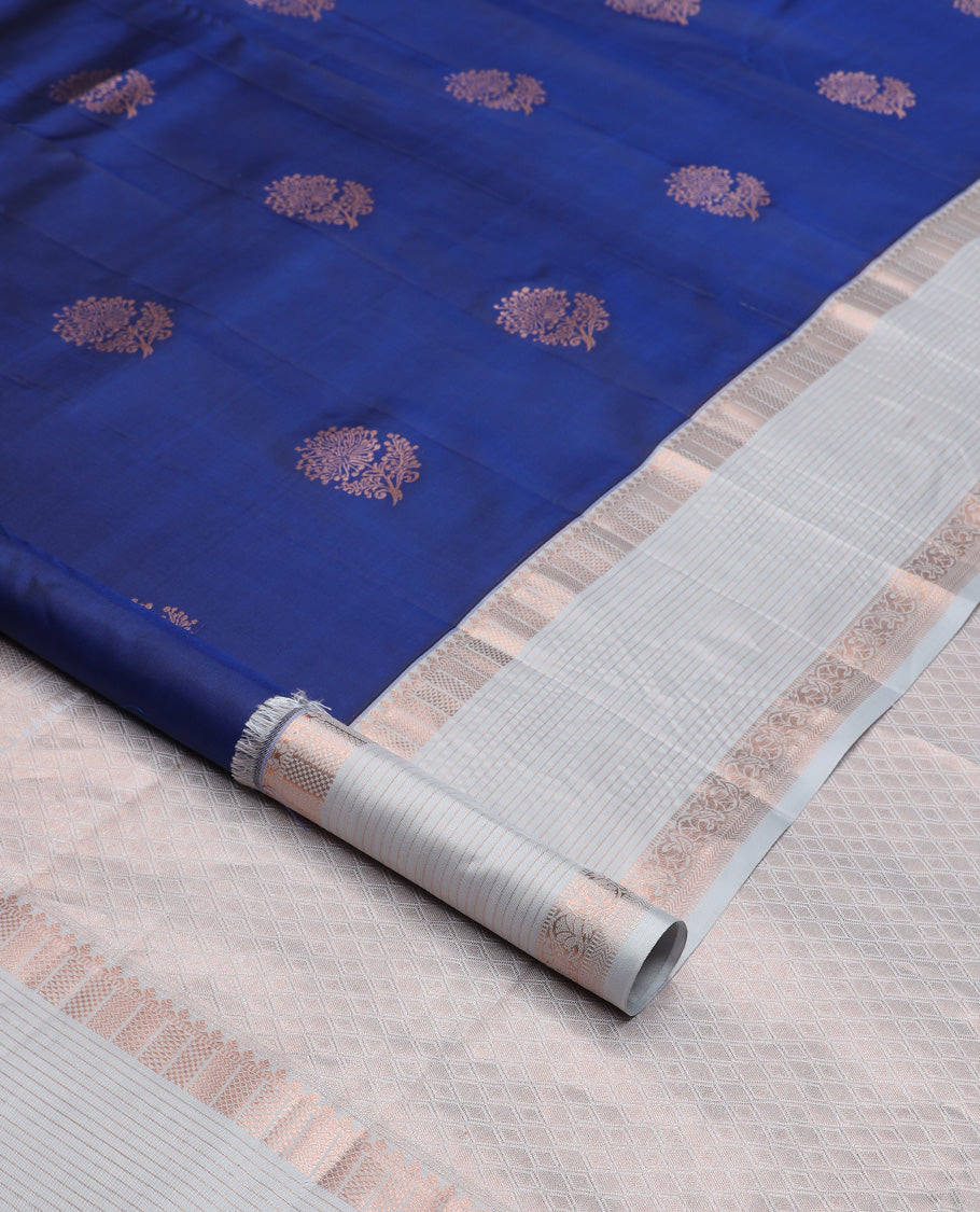 Blue floral zari buttas silk saree, contrast border of thilakam, muthu, ara maadam, kuyil kann, and vanki designs, and jaal pallu