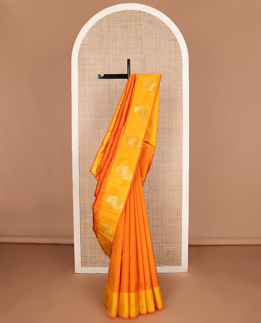 Orange zari buttas Kanchipuram silk saree, contrast floral design border, and pallu of manga designs