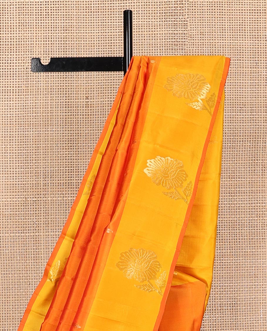 Orange zari buttas Kanchipuram silk saree, contrast floral design border, and pallu of manga designs