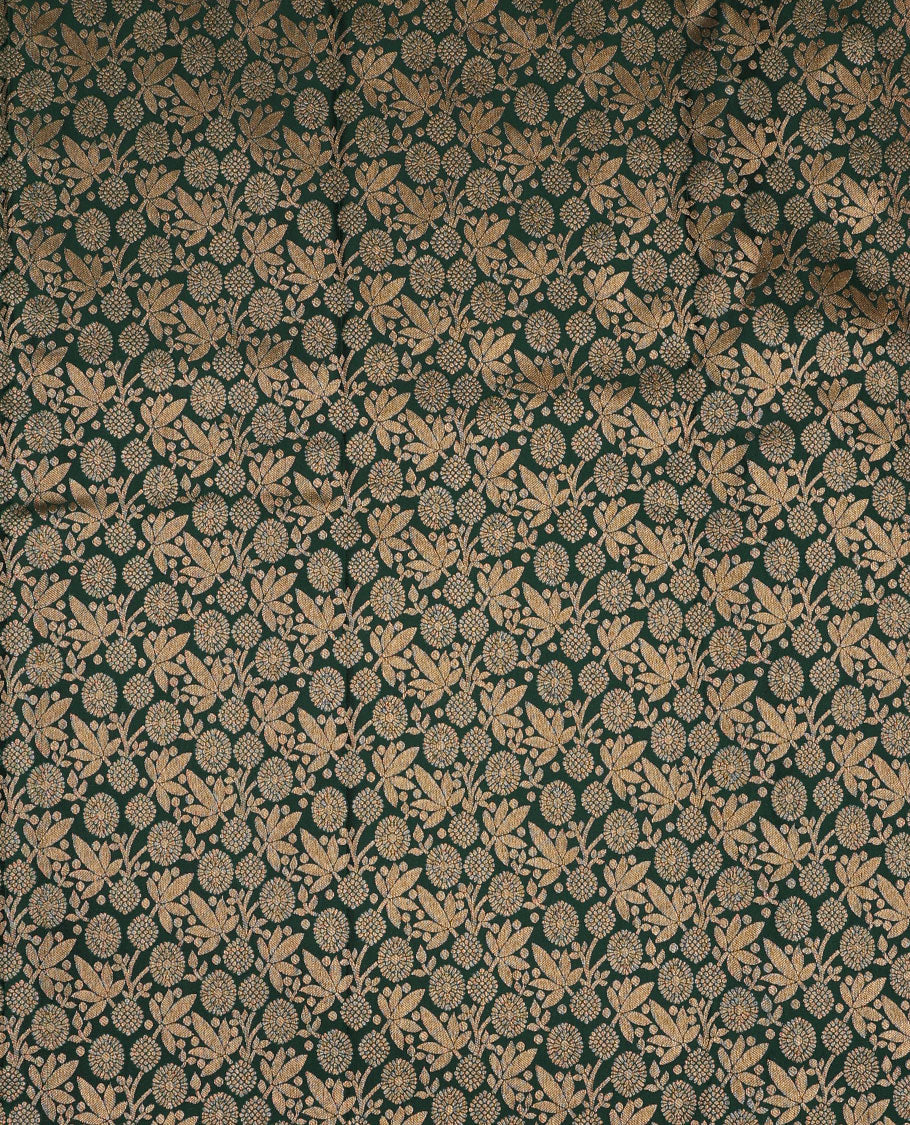 Green pure-silk half-saree, jacquard skirt, contrast blouse, and border of thilakam, banaras, poun, diamond, cross kamalam, and then kuli kann designs, and intricate dhavani