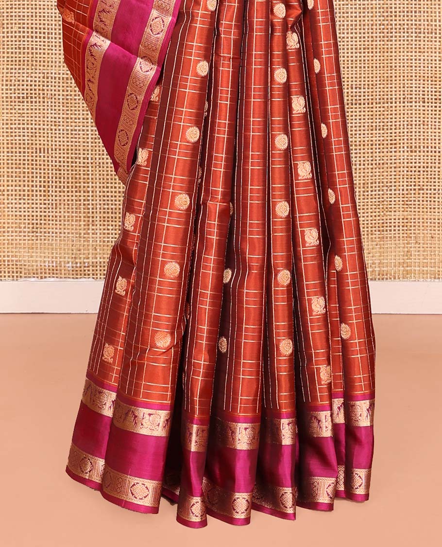 Orange Vasundhara Lite SilkMix Saree, Accentuated with Mayil Chakram Butta Enclosed Checked Design, Complemented by a Contrast Rettai Pettu Border of Thazampoo Rekku, Mayil, and Kamalam Designs, Geometric Patterned Pallu, and Paired with a Contrast Blouse