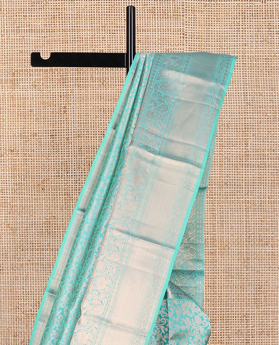 Light blue jacquard kancheepuram silk saree with self border of intricate zari design & floral design pallu