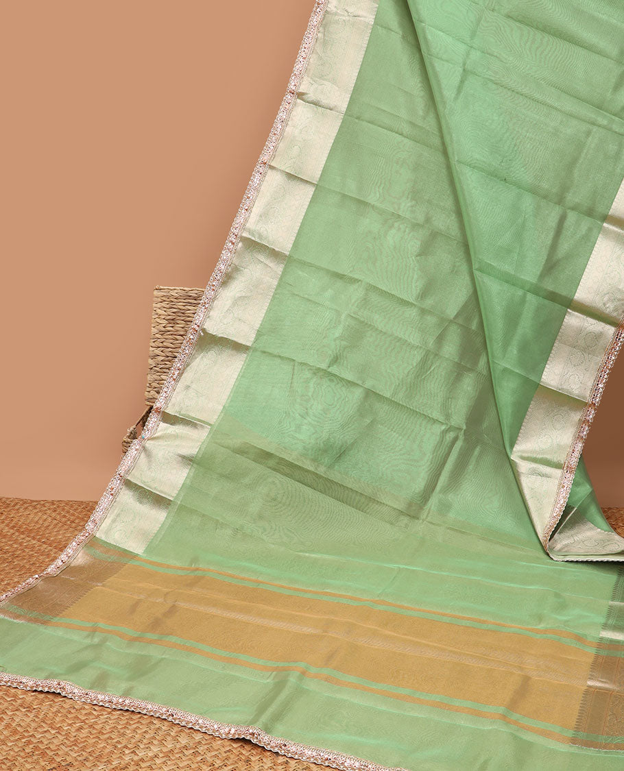 Green tissue saree with self zari design border & intricate zari design pallu