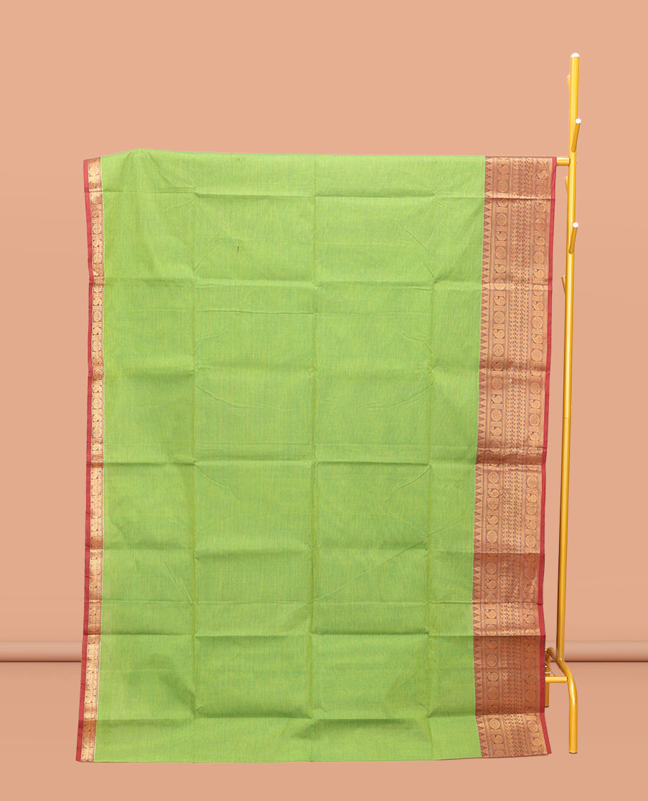 Parrot Green Plain Chettinad Cotton Saree, Complemented by a Contrast Traditional Zari Design Woven Border, Pallu of Stripes, and Paired with a Matching Blouse