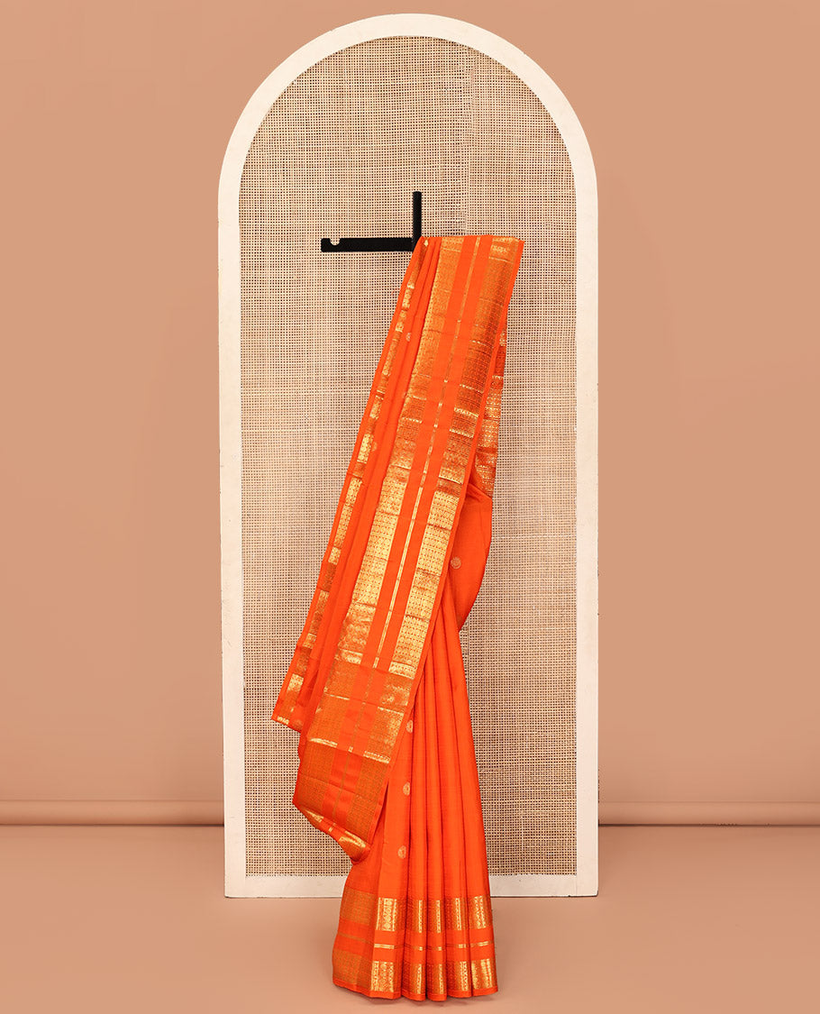 Orange Kanchipuram Silk Saree, Enthralled with Zari Buttas All Over Its Body, Highlighted by a Zari Varisai Border of Rudraksham Enclosed Muthu Kattam Designs, Pallu of Zari Designs, and Paired with a Matching Blouse