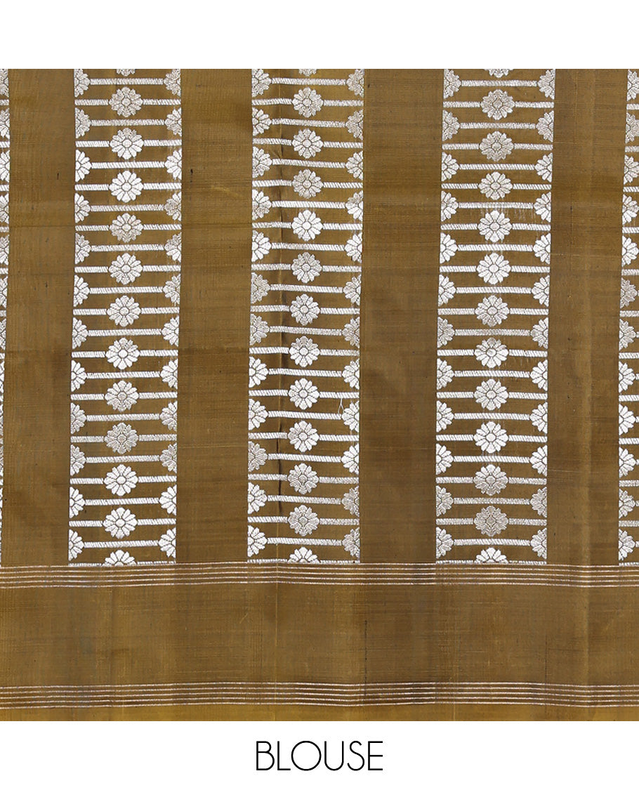 Green Mayuri Soft Silk Saree, Graced with Zari Buttas All Over Its Body, Highlighted by Zari Striped Border, Pallu Steeped with Zari Buttas, and Paired with a Matching Blouse