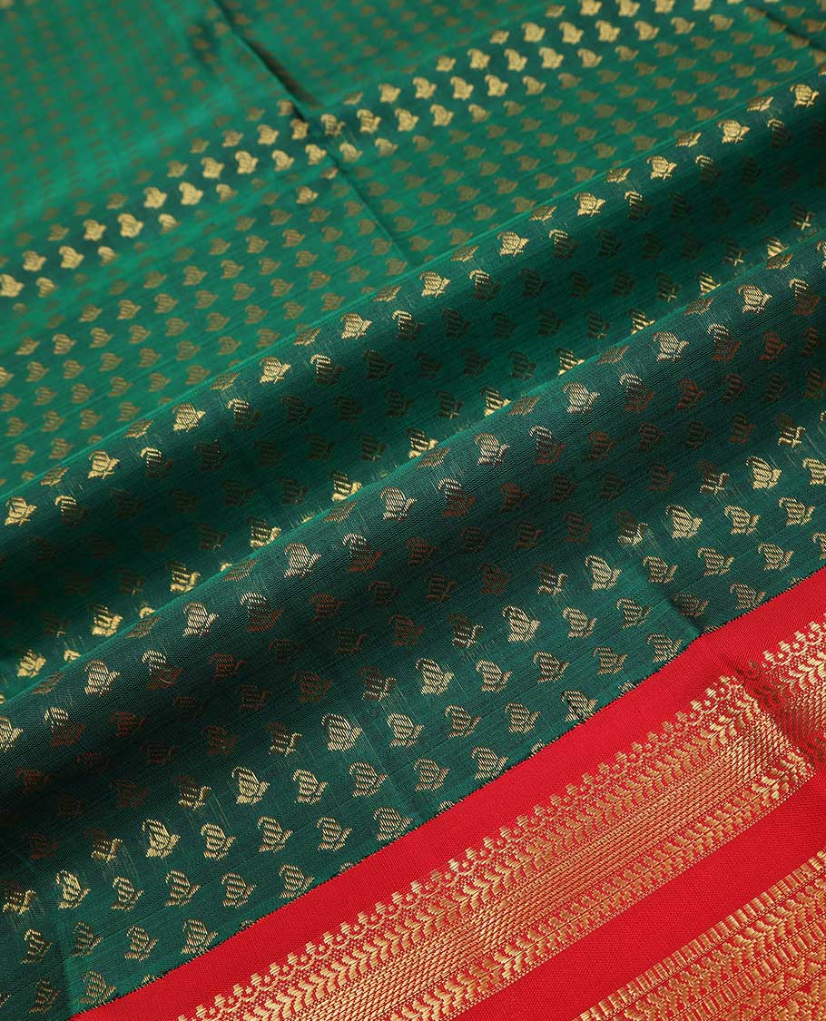 Green puresilk halfsaree, zari buttas skirt, contrast rettai pettu border, blouse of thilakam mokku, kathir, muthu, and mayil design, and zari woven pallu
