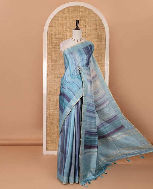 Sky blue hand brushing-style multi-colored stripes printed fancy tussar silk saree, zari border, self-pallu & blouse of zari work & stripes print