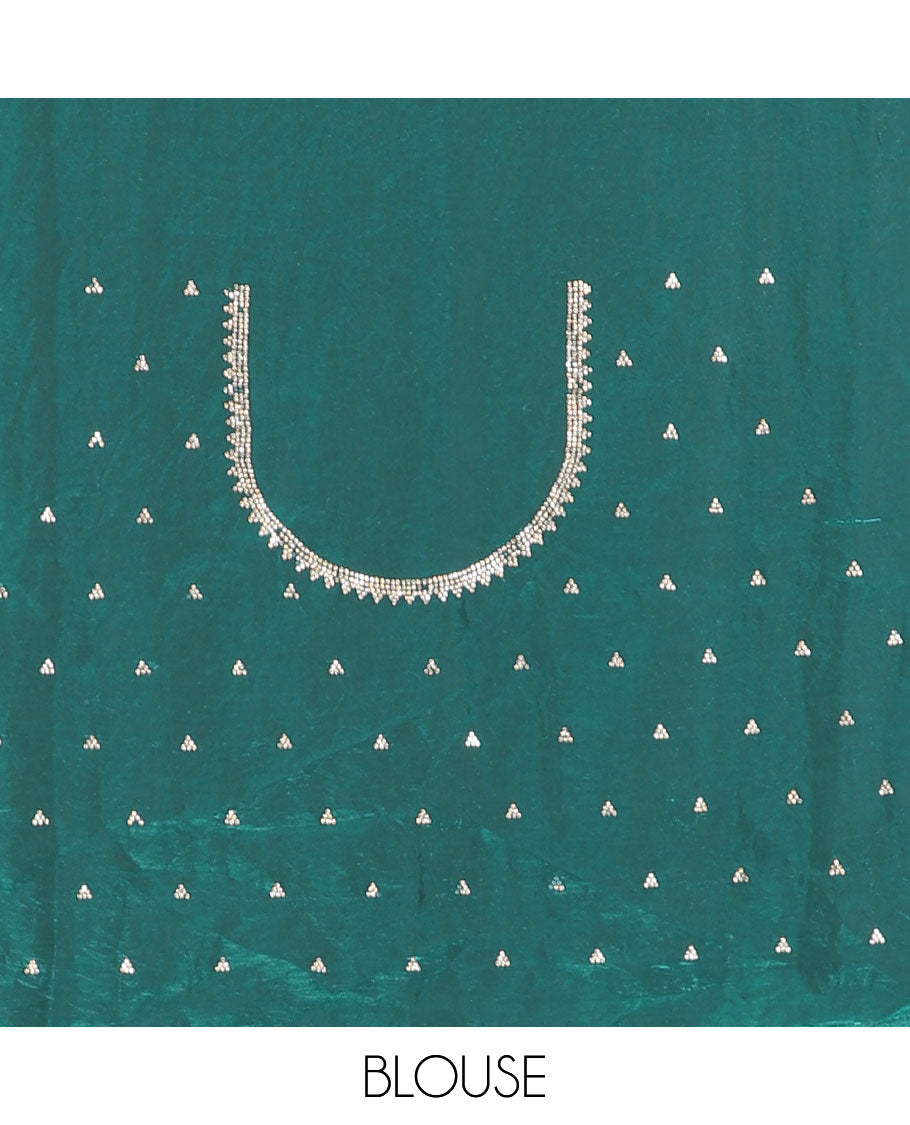 Rama green micro-stone work fendy chiffon saree with paisley stone work on its shoulder, a scallop stone work border, a butterfly style pallu, and a matching stone work blouse