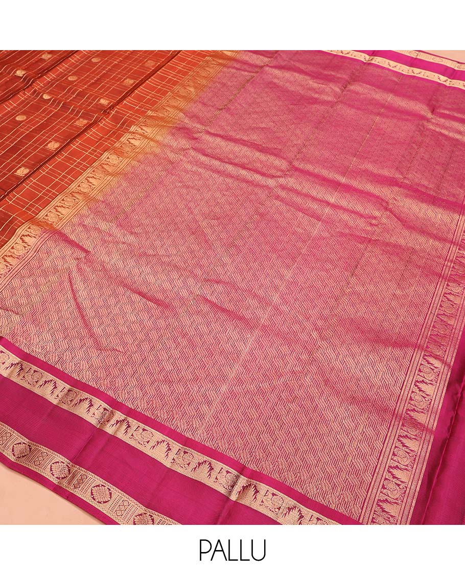 Orange Vasundhara Lite SilkMix Saree, Accentuated with Mayil Chakram Butta Enclosed Checked Design, Complemented by a Contrast Rettai Pettu Border of Thazampoo Rekku, Mayil, and Kamalam Designs, Geometric Patterned Pallu, and Paired with a Contrast Blouse