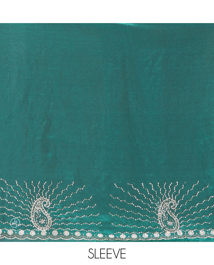 Rama green micro-stone work fendy chiffon saree with paisley stone work on its shoulder, a scallop stone work border, a butterfly style pallu, and a matching stone work blouse