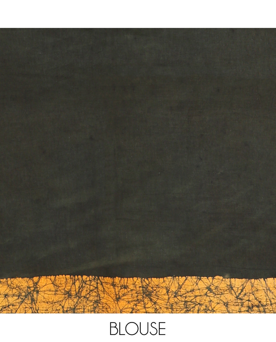 Green Mul Cotton Saree Prettified with Batik-Style Floral Motifs Printed All Over Its Body, Complemented by a Contrast Batik Printed Border, Pallu Mirrors the Same Batik Print, and Is Paired with a Matching Blouse