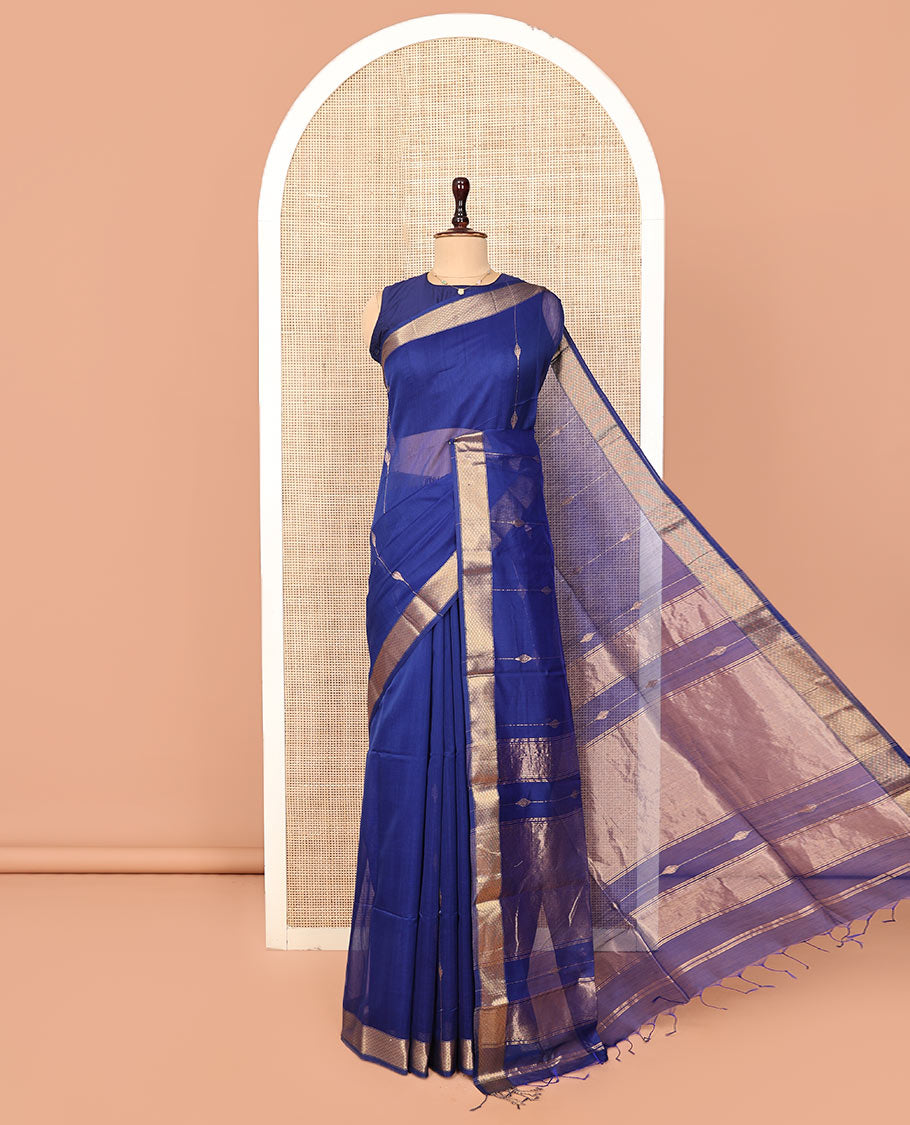 Blue Maheshwari Cotton Saree, Enthralled with Zari Stripes All Over Its Body, Highlighted by a Zari Border of Jaal Motifs, Pallu Steeped with Gleaming Zari Designs, and Paired with a Matching Blouse
