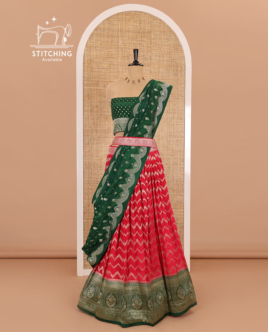 Tomato red chiniya crepe half-saree, chevron zari jacquard with contrast intricate patterned stone work bordered skirt, contrast blouse, and a scallop bordered intricate dhavani