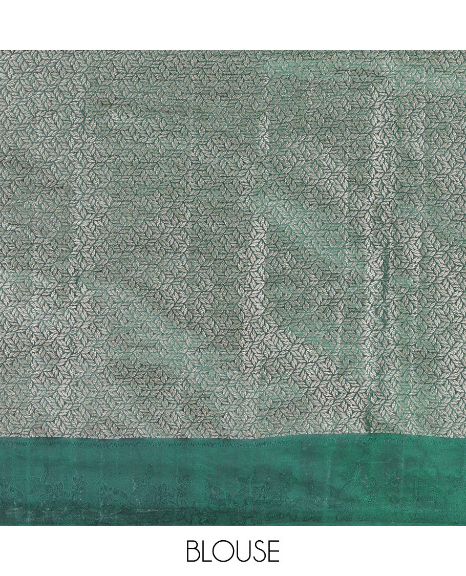 Green Semi-Tussar Saree, Ornamented with Floral Jacquard Design, an Embossed Border, a Floral Pallu, and a Matching Blouse