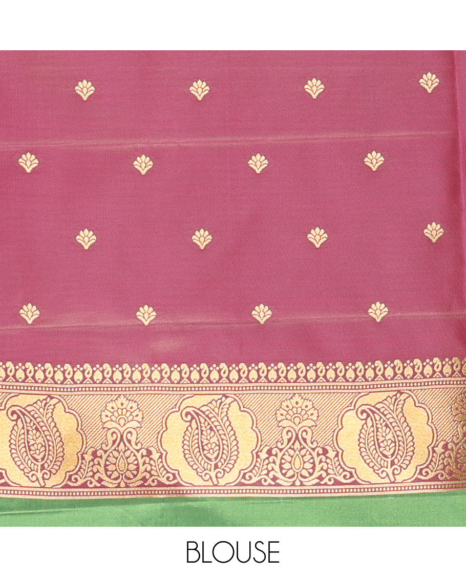 Forest Green Kanchi Soft Silk Saree, Majestically Detailed with Vaira Oosi, and Zari Buttas All Over Its Body, Complemented by Contrast Border of Paisleys, an Intricately Designed Pallu, and Paired with a Contrast Blouse