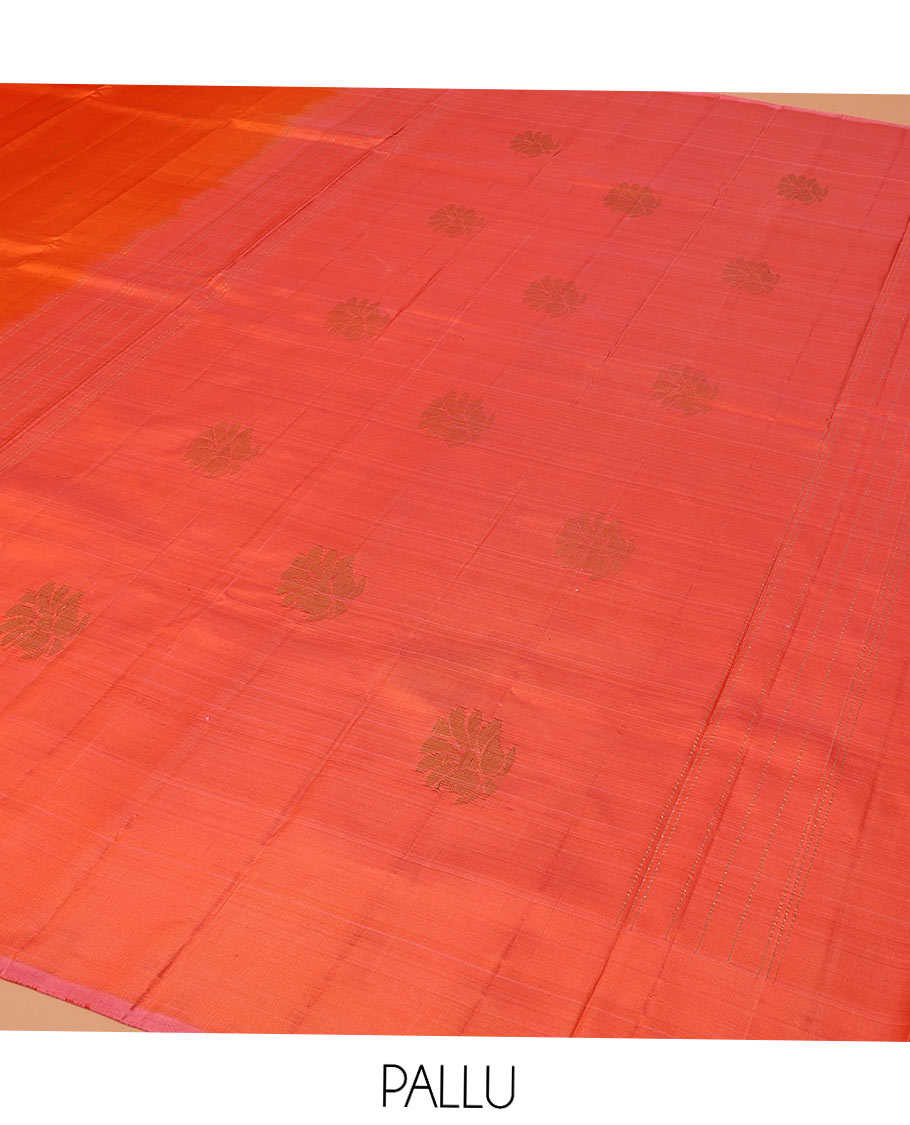 Orange Kanchipuram Silk Saree, Subtly Sparkled with Zari Buttas on Its Body, Complemented by a Contrast Border of Manga Designs, Pallu Steeped with Floral Designs, and Paired with a Contrast Blouse