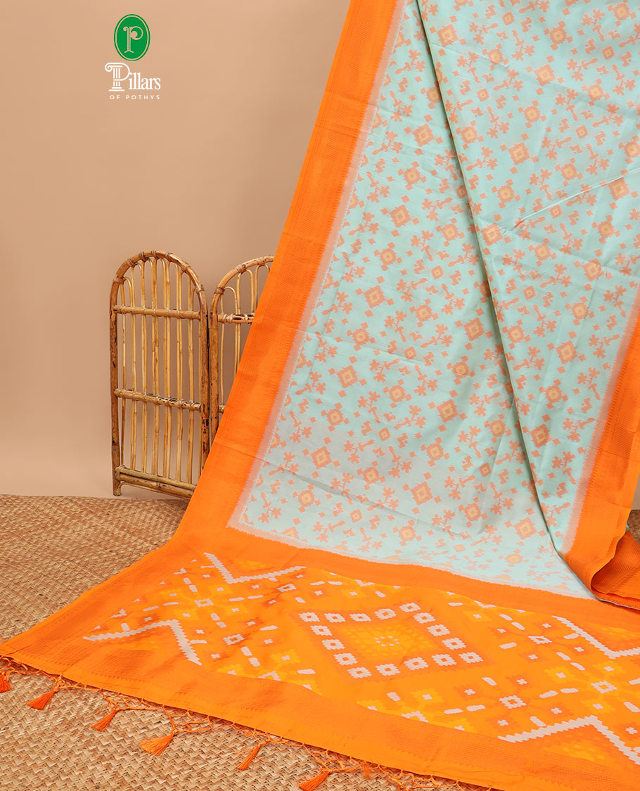 Sea green ikkat design mulberry silk saree with contrast border & ikkat pallu along with self embosed butta blouse