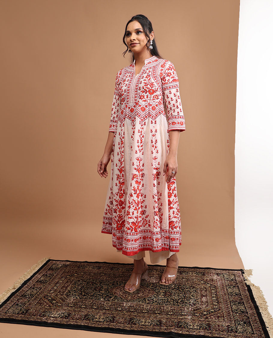 White floral design v neck, 3/4 th sleeve, below knee lenght top with straight pants