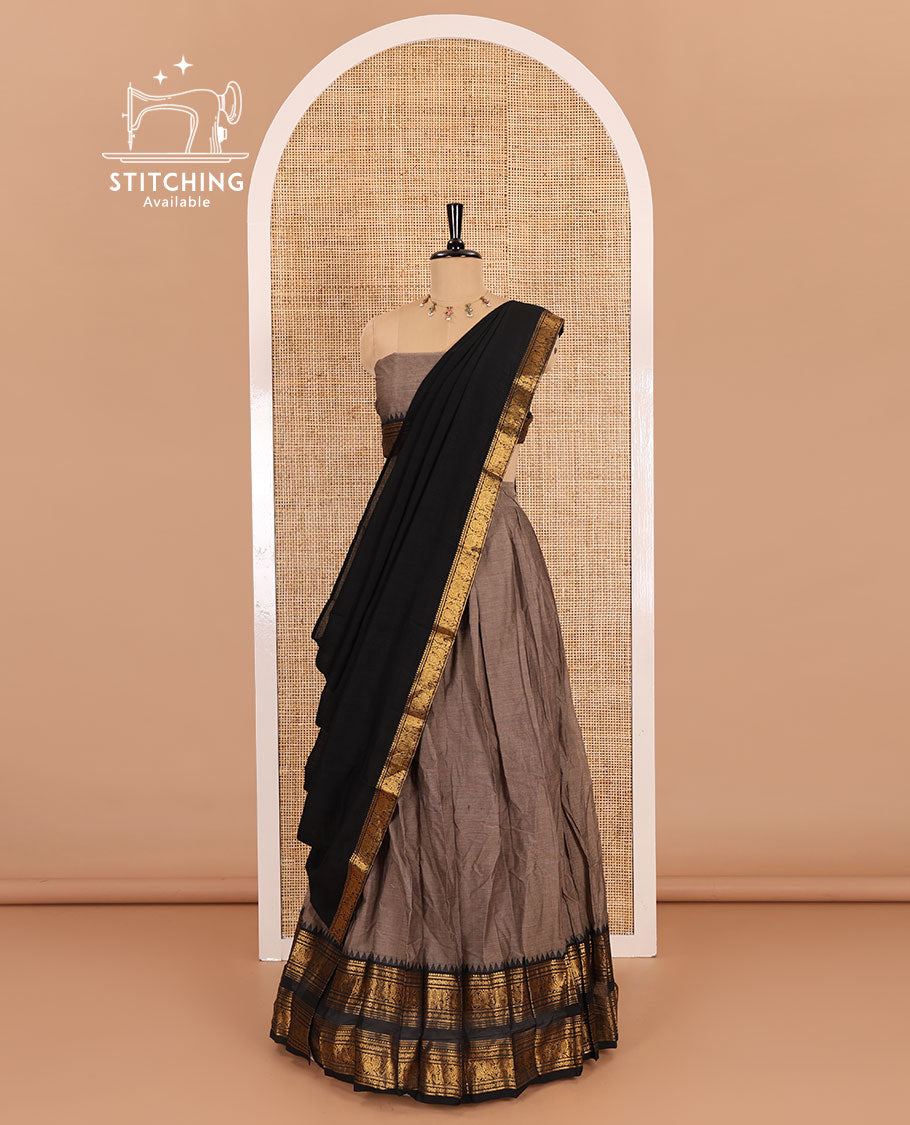 Grey-black sungudi cotton half-saree, plain with contrast traditional zari varisai pettu bordered skirt, a matching blouse, and a zari bordered dhavani