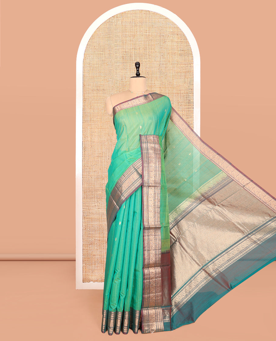 Sea Green Silk Cotton Saree, Elevated with Buttas, Complemented by Contrast Traditional Paisley Zari Design Border, Zari-Decked Pallu, and a Contrast Blouse