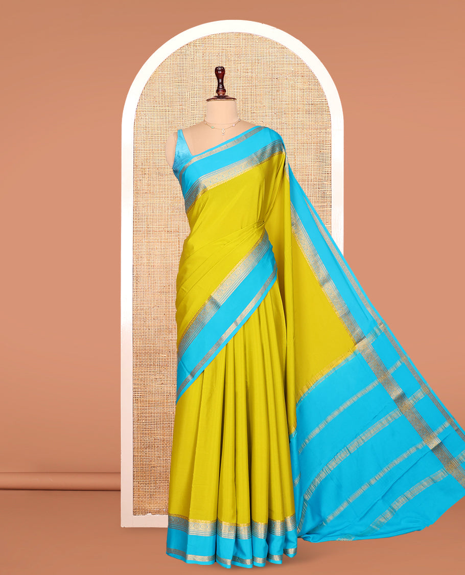 Green Plain Mysore Silk Saree, Complemented by Captivating Contrast Border of Traditional Zari Designs, Subtly Striped Pallu, and Paired with a Contrast Blouse