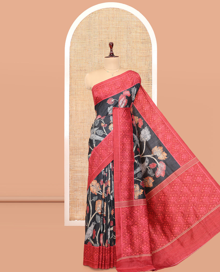 Black Fancy Tussar Saree Features Kalamkari Floral Vine and Bird Print, Contrast Patola Border, Patola Pallu, and a Contrast Blouse