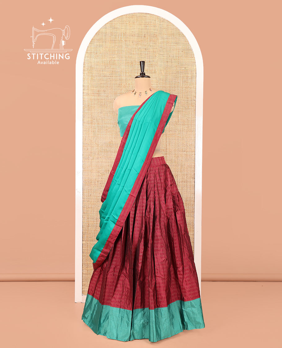 Magenta and Green Checked Taffeta Silk Half-Saree, Complemented by Contrast Sparsely Striped Border, Paired with a Contrast Blouse, and Comes with Subtle-Bordered Satin Georgette Dhavani