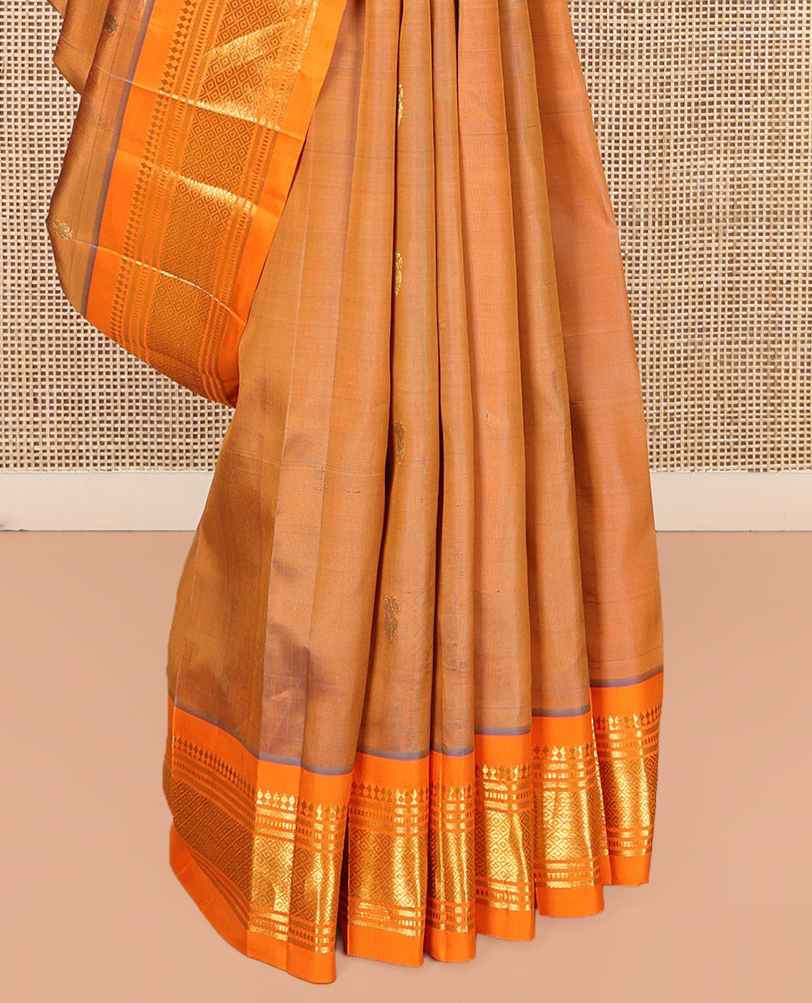 Orange Kanchipuram Silk Saree, Decorated with Zari Buttas, Complemented by a Contrast One-Sided Border of Panner Sombu, Banaras, Muthu, and Jaal Designs, Grand Pallu, and No Blouse