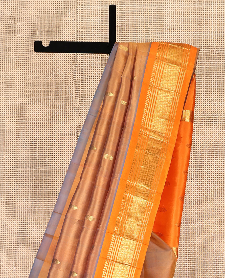 Orange Kanchipuram Silk Saree, Decorated with Zari Buttas, Complemented by a Contrast One-Sided Border of Panner Sombu, Banaras, Muthu, and Jaal Designs, Grand Pallu, and No Blouse