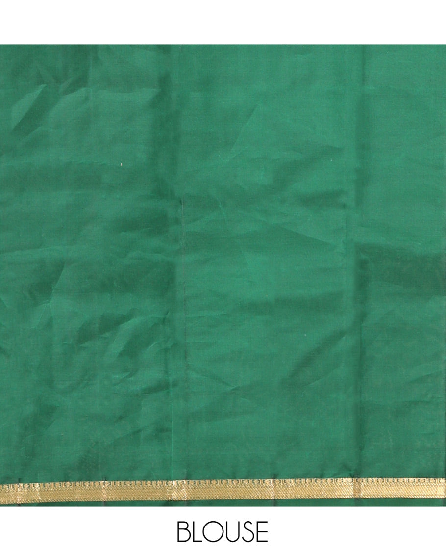 Green Vasundhara Silk Saree, Majestically Detailed with Zari Buttas and Mayil-Yaanai Buttas, a Subtle Zari Border, Jaal Pallu, and a Matching Blouse