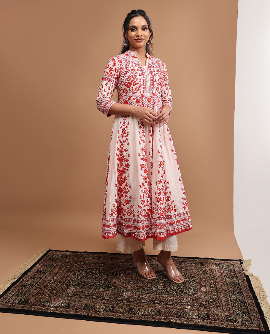 White floral design v neck, 3/4 th sleeve, below knee lenght top with straight pants